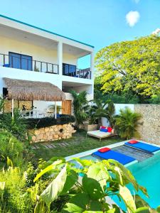 an image of a villa with a swimming pool at Mayan Majesty Boutique Hotel in Valladolid