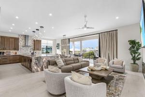 a living room with a couch and a table at Oyster Cluster in Fort Myers Beach