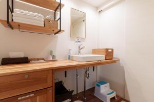 a bathroom with a sink and a mirror at Fujiyasan in Fujikawaguchiko +28 photos