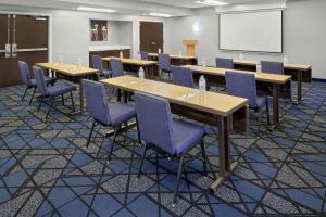 a classroom with tables and chairs and a whiteboard at Courtyard Birmingham Hoover in Hoover +26 photos