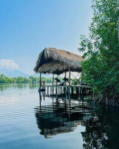 a hut on a dock in the middle of the water at Entremares in Boca del cielo +100 photos