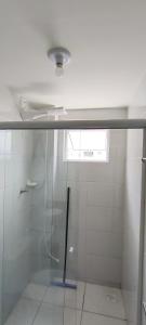 a shower with a glass door in a bathroom at Doce Encanto in Uberaba +22 photos
