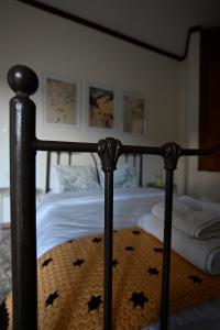 a bed with a black frame with stars on it at Valley Parnass in Arachova