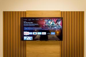 a flat screen tv hanging on a wall at Conco Leipzig in Leipzig