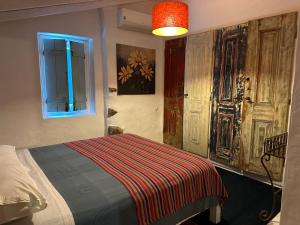 a bedroom with a bed and a window at Courela do Monte Novo in Monte de Jangeis de Cima +45 photos