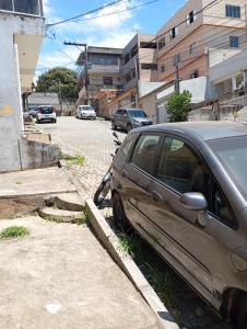 a car parked on the side of a street at Kitnet Ateneu in Vila Velha