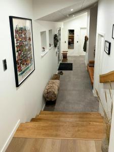 a hallway of a store with a couch on the wall at Architect-Designed House In Juelsminde in Juelsminde