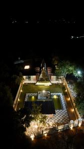 an aerial view of a backyard at night at The triangle haven escape in Ani
