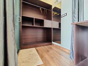 a closet with wooden doors and a wooden floor at Chitrangan The Homestay of Udaipur in Udaipur