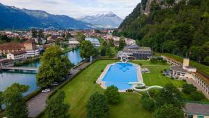 an aerial view of a town next to a river at The Golf apartments in Interlaken