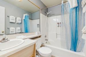 a bathroom with a sink and a toilet and a shower at Sea Treasures Inn #207 in Rockaway Beach +11 photos