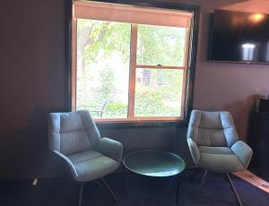 two chairs and a window in a room at 187 Heathcote in Heathcote