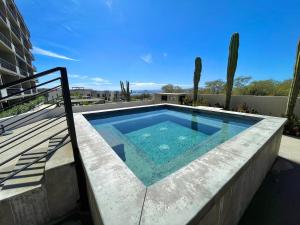 a swimming pool on the roof of a house at Marea Sabina Luxury Ocean View & Amenities in Cabo San Lucas