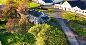 an aerial view of a farm with a house and a barn at Skógafoss in Hvolsvöllur