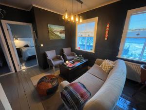 a living room with a couch and a bedroom at Skógafoss in Hvolsvöllur