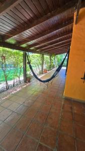 a porch with a hammock in a house at Casa Refugio in Paso de la Patria