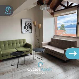 a living room with a couch and a table at CyclosApart Bariloche in San Carlos de Bariloche