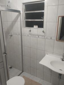 a bathroom with a shower and a sink and a toilet at Pousada Refúgio Natural da Ilha in Ilha Comprida +36 photos