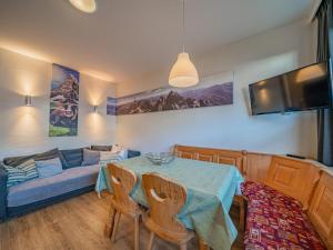 a living room with a table and a couch at Hohe Tauern-Großvenediger in Mittersill