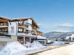 a building with snow piled up around it at Itterblick in Itter