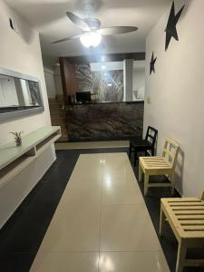 a living room with a table and stars on the wall at Hotel Sharidia Inn in Veracruz