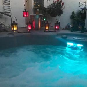 a large swimming pool with lights and candles in it at Pride Lodge in Blackpool