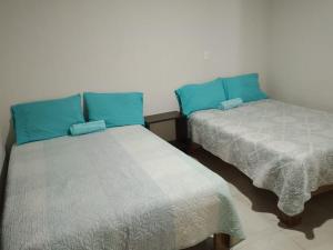 Lova arba lovos apgyvendinimo įstaigoje Hotel Mi Casa Mata