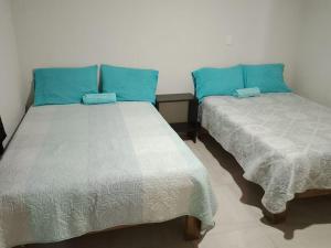Lova arba lovos apgyvendinimo įstaigoje Hotel Mi Casa Mata