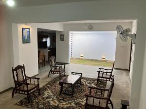 a room with chairs and a table and a window at Seth Villa Matara in Matara