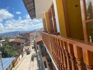 a balcony of a building with a view of a city at Attic Hotel in Chachapoyas