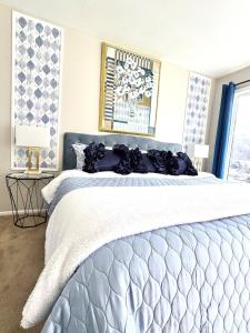 a bedroom with a large bed and a window at Lakefront Condo Private Deck 3 Pools in Osage Beach