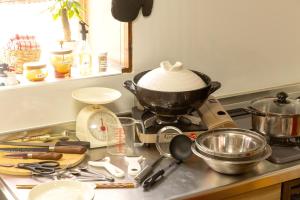 a kitchen counter with a mixer and other kitchen utensils at inn 1st in Yakage