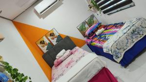 a dorm room with a bed and a table at KAMI roomstay 2 in Kampong Banggol Lalang +7 photos