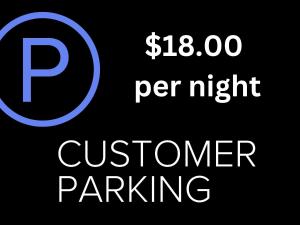 a sign that says p per night customer parking at Deco Hotel Canberra in Canberra