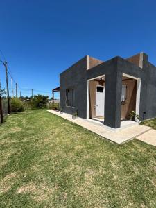 a rendering of a house with a yard at LaMeyacasaquinta in Concepción del Uruguay