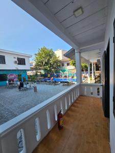 a balcony with a view of a swimming pool at Apatuxay Vientiane Hostel in Vientiane
