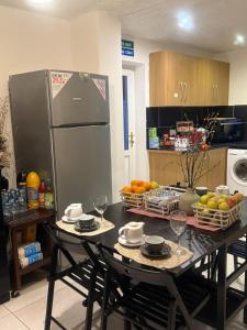 a kitchen with a table with plates and wine glasses at Eastern Bridge House in Spinney Hill +50 photos