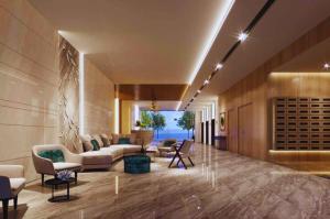 a lobby of a hotel with couches and chairs at CSJ Tower Seaview Apartment -Luxury Near Back Beach Vung Tau City in Vung Tau