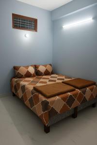 a large bed in a room with at Independent homestay DDN in Dehradun