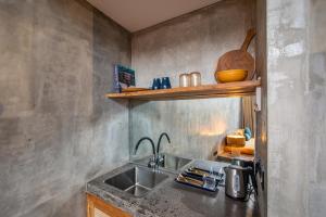 a kitchen with a sink and a counter top at The Echo Studios HUGE 100m to beach 1 in Badung