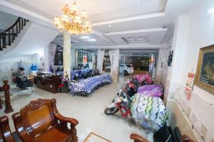 a room with a bunch of motorcycles parked in it at Thanh Tâm Hotel in Can Tho +34 photos