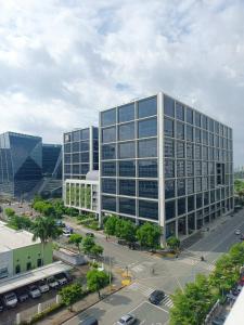 an office building with a parking lot in front of it at 963 D shore 1 in Manila