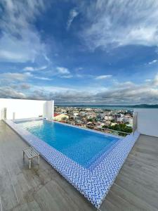 a swimming pool on the roof of a building at Bernwood Tower IloIlo - Heavens Crib in Iloilo City