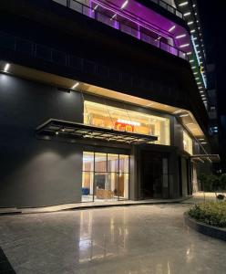 a building with a sign on the side of it at Galaxy Blue sapphire Plaza Square Residency in Ghaziabad