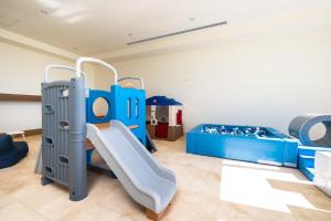 a play room with a slide and bunk beds at Beachfront townhouse TH03A in Cruz de Huanacaxtle