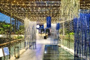 a room filled with lots of blue and white lights at Baitong Hotel & Resort Phnom Penh in Phnom Penh