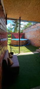 a patio with a bench and a swimming pool at Mítica, Casa Hospedaje in Sauce