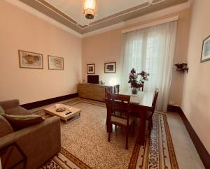a living room with a couch and a table at L'Angolo di Palermo in Palermo
