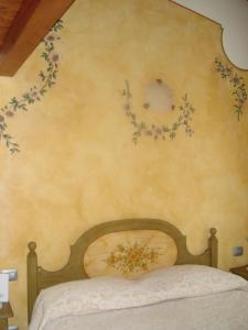 Postel nebo postele na pokoji v ubytování B&B I fiori di Marianna