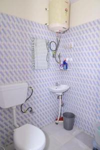 a bathroom with a toilet and a sink at The Boho BNB in Shimla